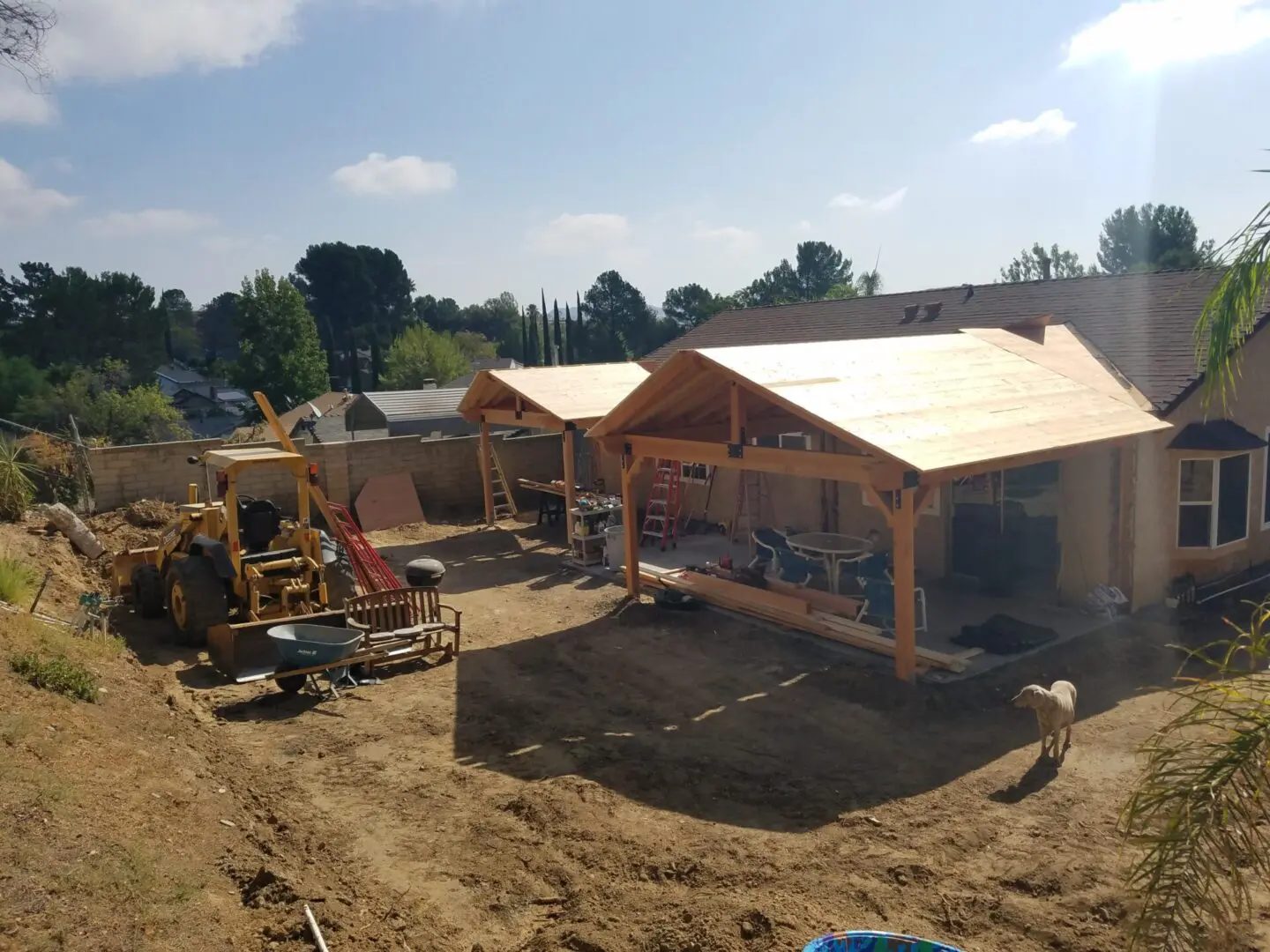 A construction site with many buildings and equipment.