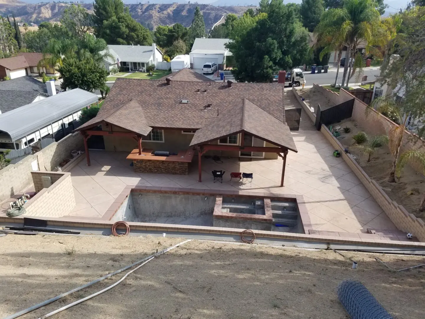 A large house with a pool in the middle of it