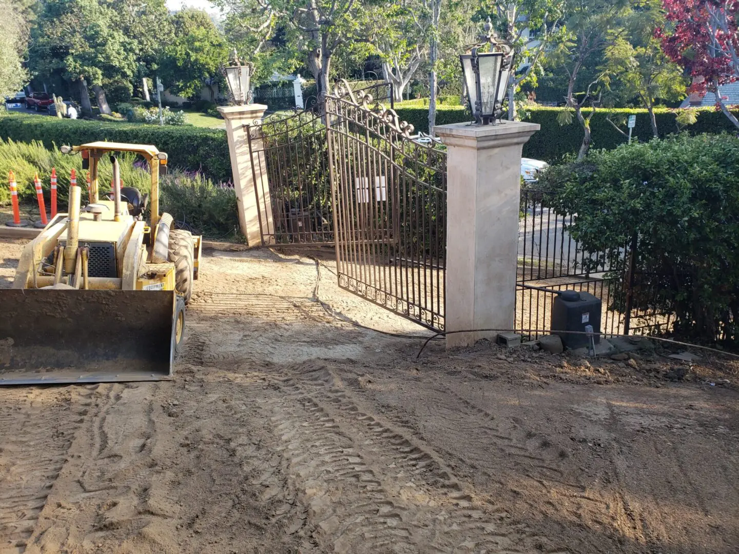 A tractor parked in front of a gate.