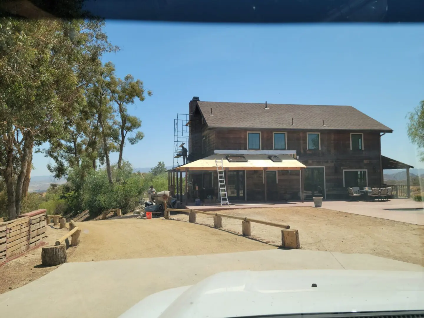 A view of a house from the car window.