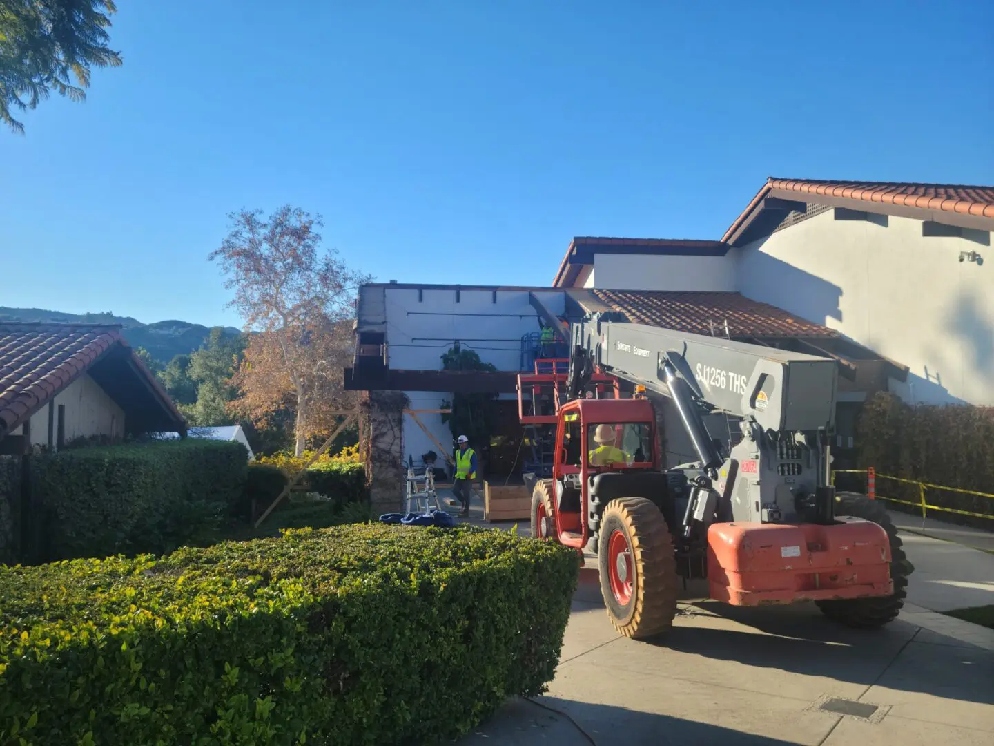 A large truck parked in front of a house.