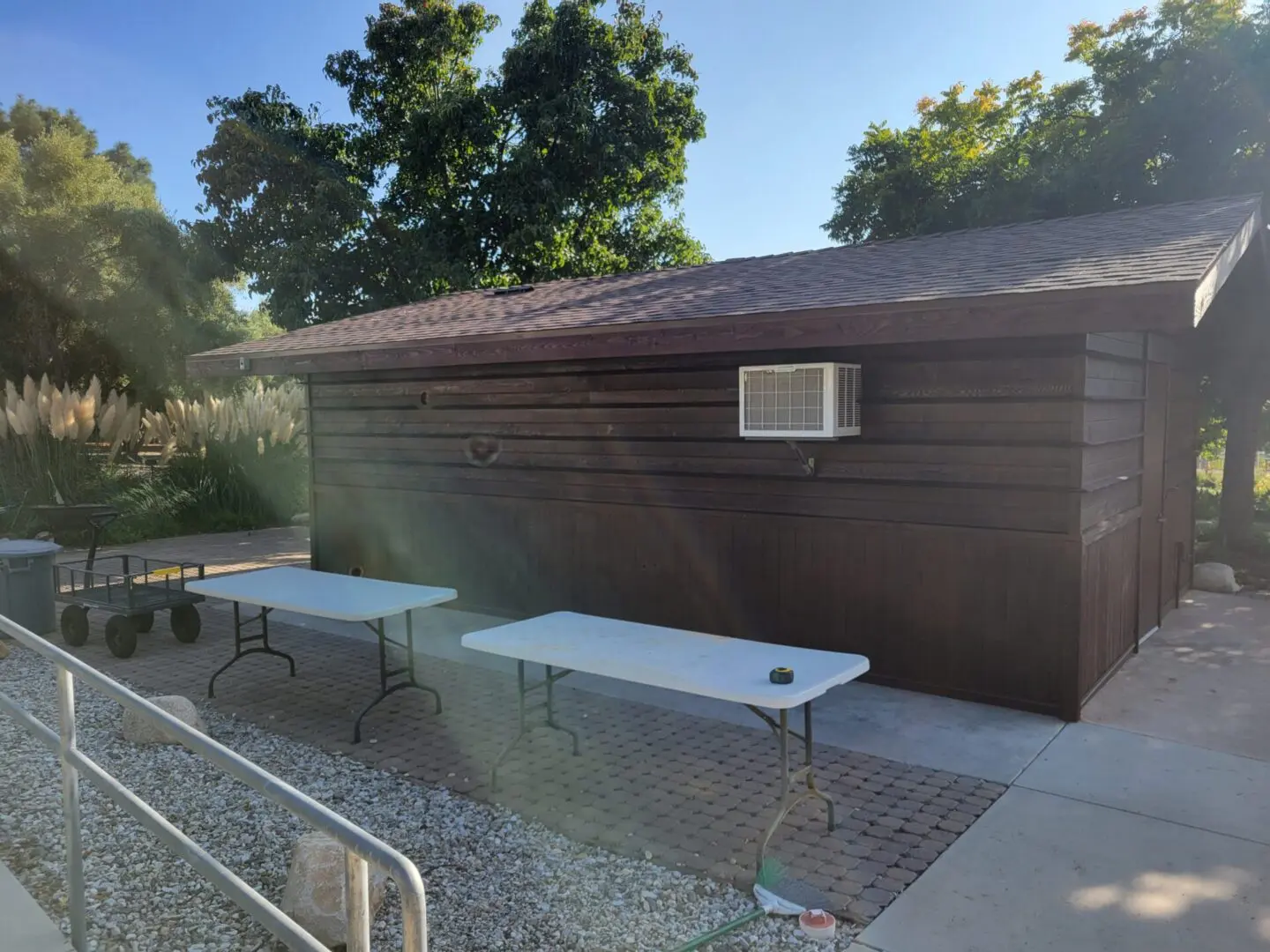 A group of tables sitting in front of a building.