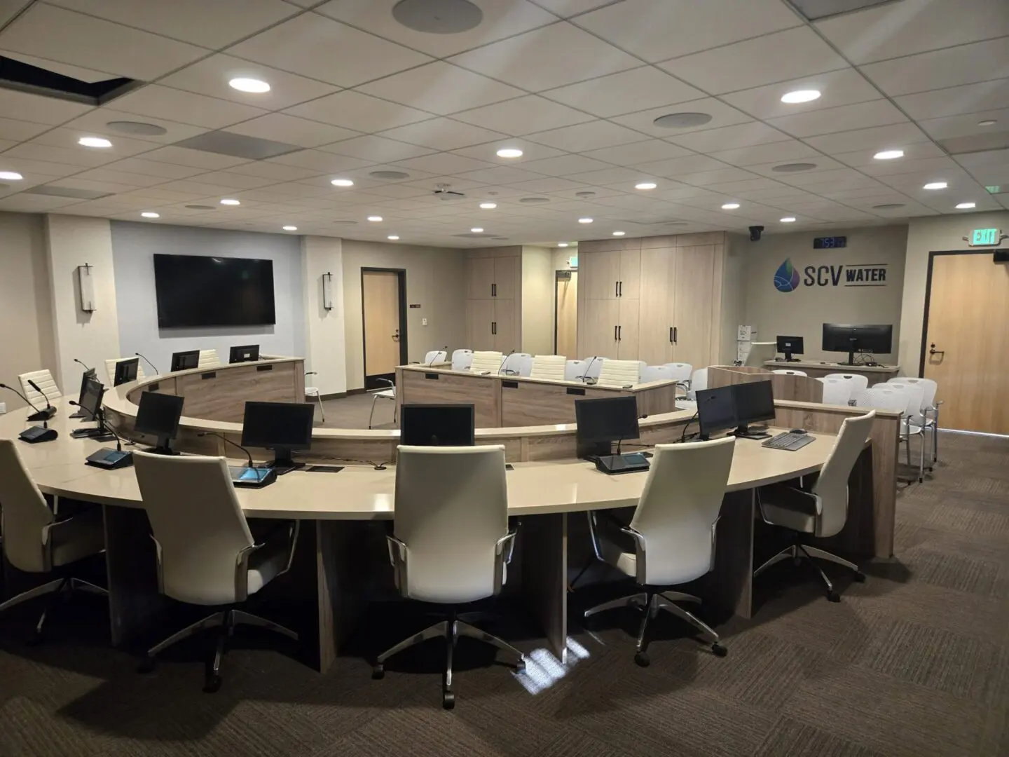 A large conference room with many chairs and tables.