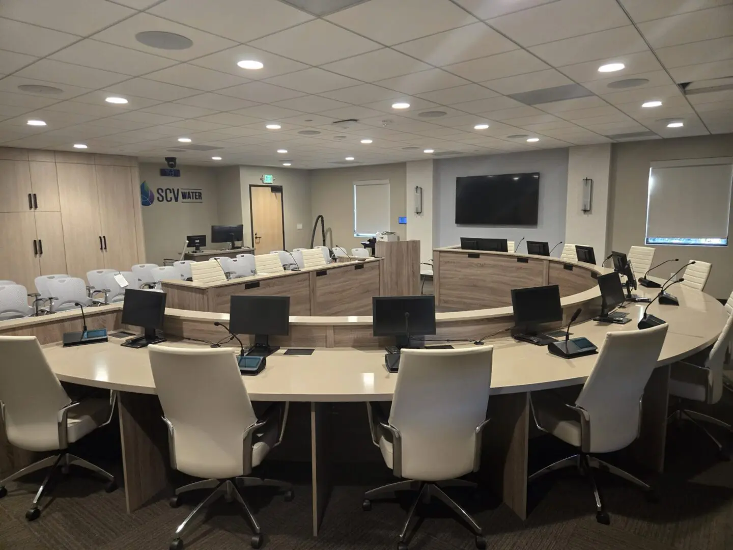 A large conference room with many chairs and tables.