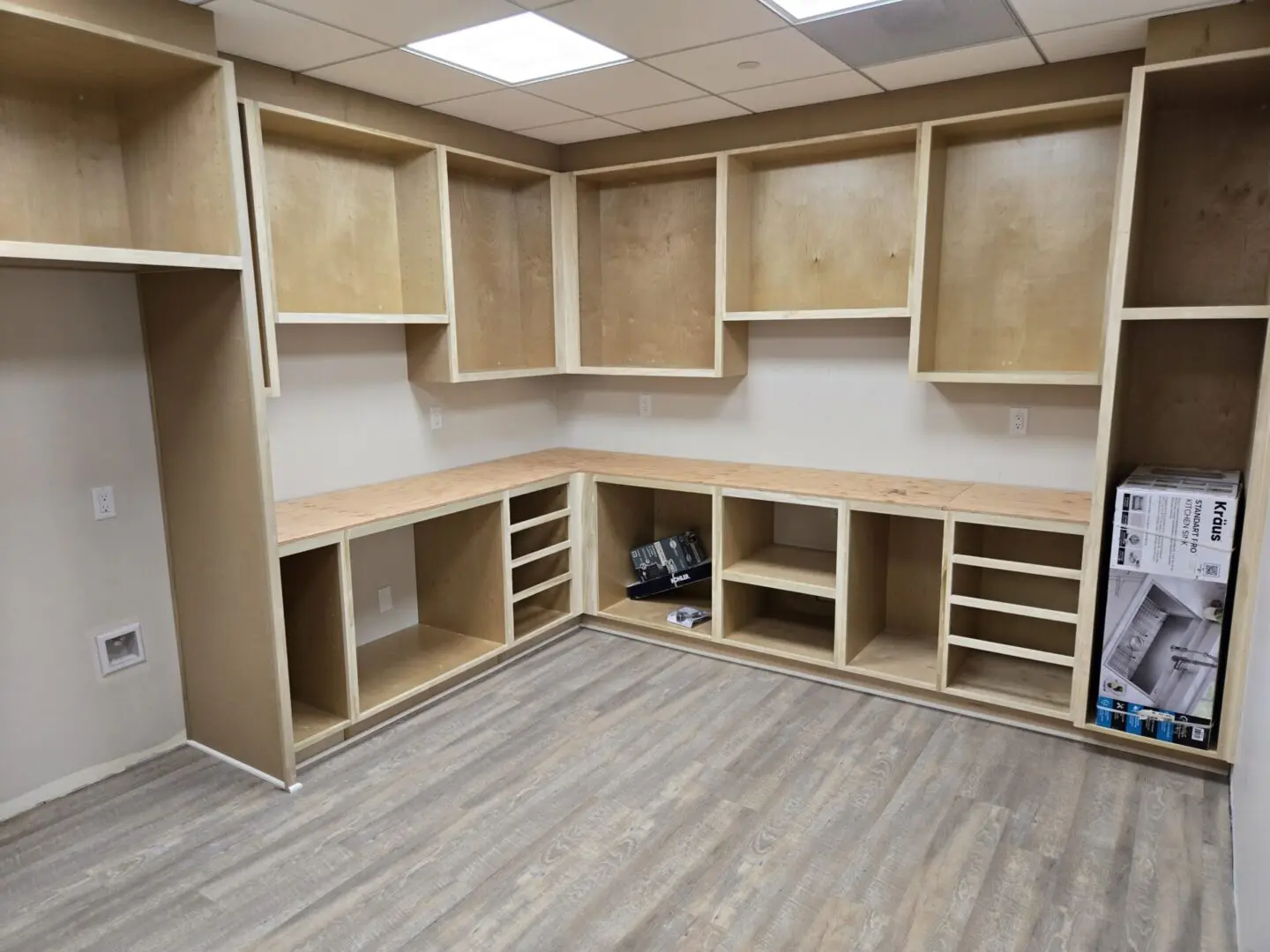 A room with many shelves and cabinets in it