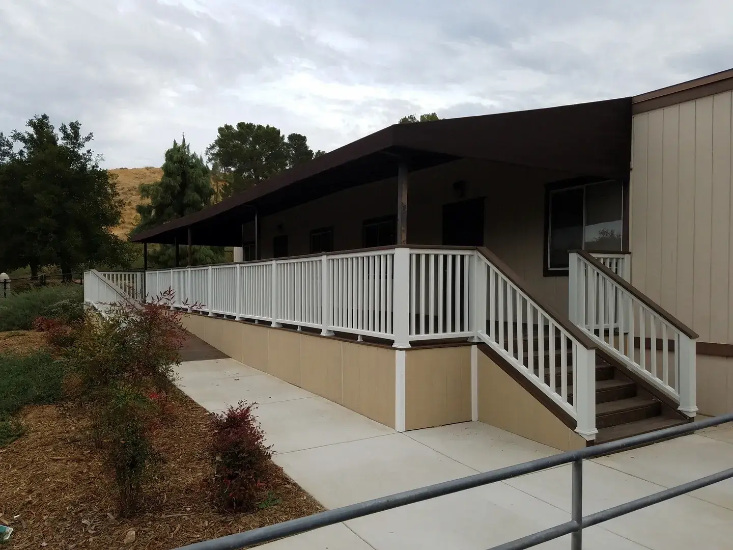 A building with stairs leading to the front of it.